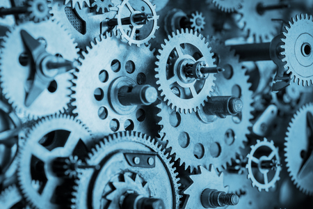 Gears and cogs macro in vintage old mechanism blue tonedの写真素材