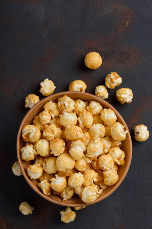 Caramel popcorn in bowlの写真素材