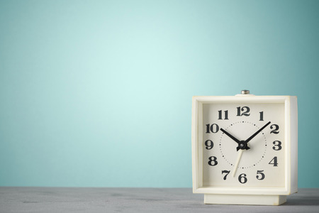 Retro old classic alarm clock blue vintage color background with copy spaceの写真素材