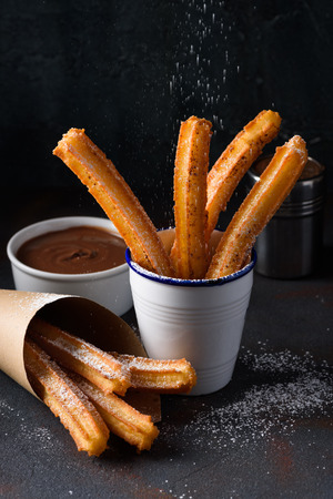 Churros sprinkling with sugar powderの写真素材