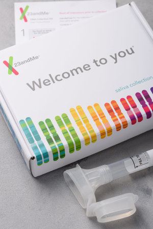 Kiev, Ukraine - 17 October 2018: 23andMe genome saliva collection kit with tube box and...