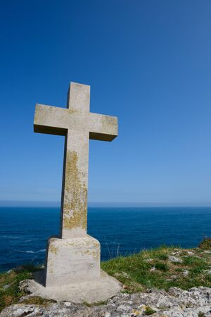 Christian cross on ocean shoreの写真素材