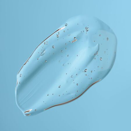 Cosmetic liquid transparent clear gel smudge with bubbles on blue backgroundの写真素材