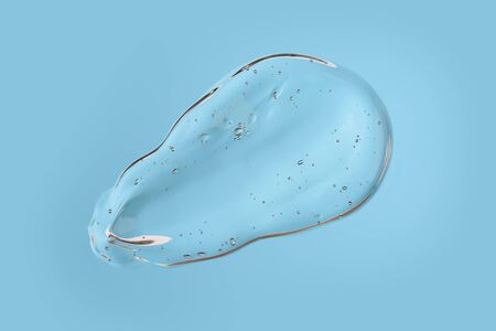 Cosmetic liquid transparent gel smudge with bubbles on blue backgroundの写真素材