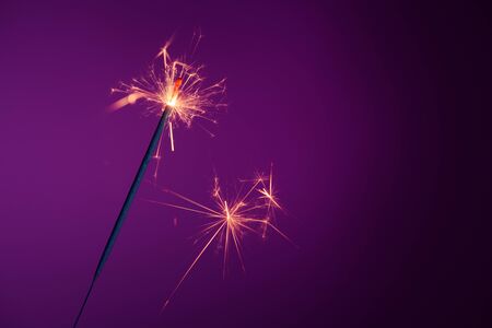 Brightly burning party sparkler with sparksの写真素材