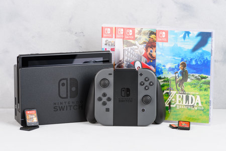 Krakow, Poland - Januray  14, 2020: Nintendo Switch gaming console with popular Zelda and Mario games and game cards still-life.のeditorial素材