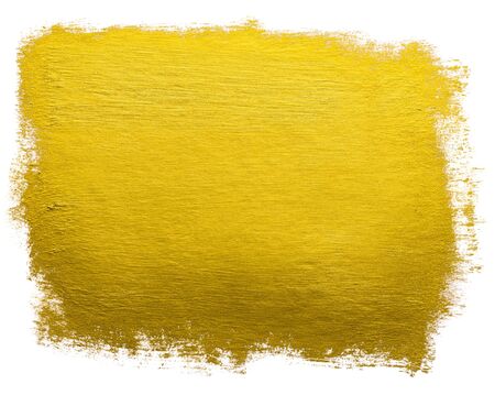 Gold paint wide brush stroke metallic foil color design element isolated on white background.の写真素材