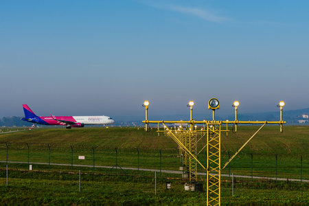 Krakow, Poland - October 24, 2019: Wizz Air passenger airplane leaves for the airport runway.のeditorial素材