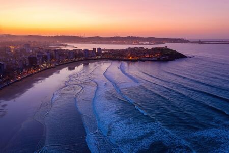 Gijon downtown and San Lorenzo beach aerial drone view at twilight. GijÃ³n or XixÃ³n is the biggest city in Asturias Spain.の写真素材