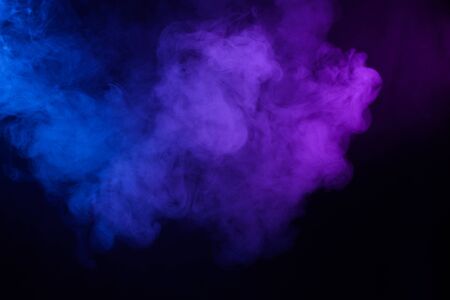 Smoke cloud pink and blue abstract dark backgroundの写真素材