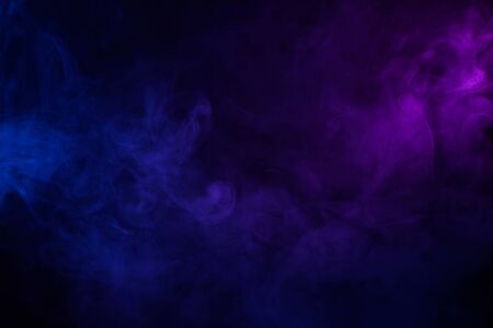 Soft clouds of colorful smoke dark abstract backgoundの写真素材