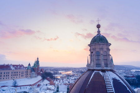 Winter in Krakow Poland aerial view. Saints Peter and Paul Church dome and Wawel Royal Castle with...