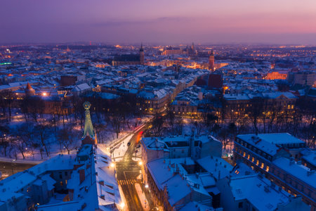 Krakow city center old Town at winter aerial view. Globe tower on Basztowa street, Pod Globusem, and St. Mary's Basilica and Town Hall Tower and Wawel Castle on background.の写真素材