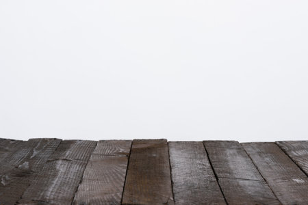 Wooden table from old planks, empty for your product, with neutral gray backgroundの写真素材