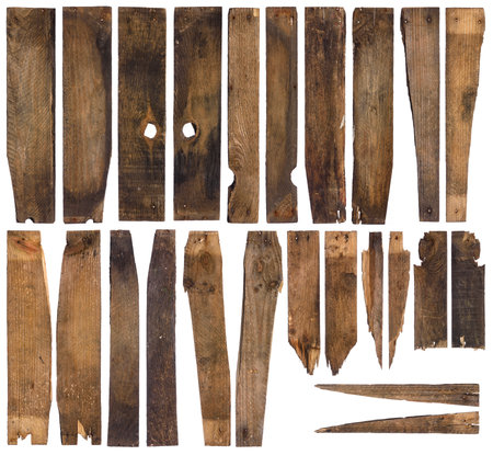 Old barn wooden planks, front and back side of each piece, isolated on white. Broken distressed and weathered wood.の写真素材