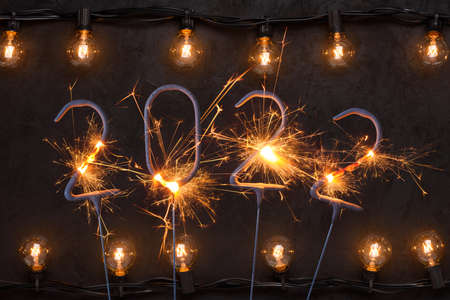 2022 Happy new year card with with glowing light bulbs garlandの写真素材