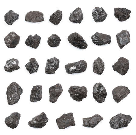 Anthracite hard stone coal lumps isolated on white background top view. Highest carbon content and energy density of all types of coal.の写真素材