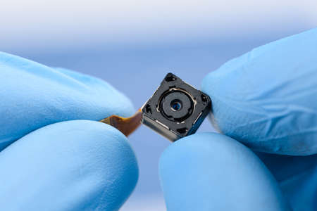 New high resolution camera sensor module in scientist hands in laboratory.の写真素材
