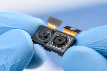 Smartphone dual camera system module in scientist handsの写真素材
