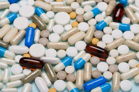 Assorted pills background, different medicine drugs capsules.の写真素材