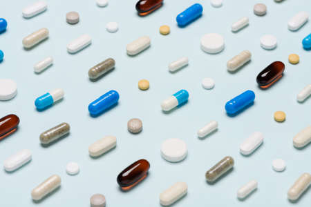 Pattern of medicine pills drugs on blue backgroundの写真素材