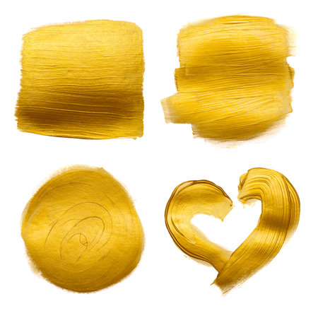 Gold metallic foil paint hand brush strokes set smudge design element isolated on white background.の写真素材