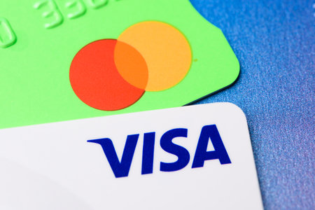 Krakow, Poland - April 29 2022: Close-up of two credit cards Visa and MasterCardのeditorial素材