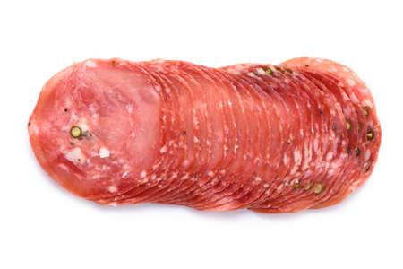Dried smoked salami sausage slices stack with pepper isolated on white background top viewの写真素材