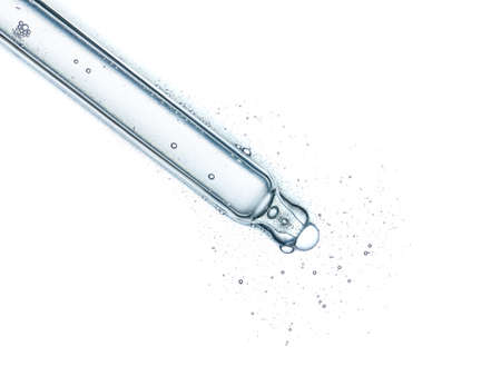 Cosmetic pipette with clear skincare serum isolated on white background top viewの写真素材
