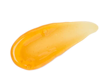 Clear orange gel smear smudge with bubbles macro isolated on white background top viewの写真素材