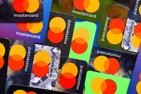 Krakow, Poland - April 27 2022: Mastercard plastic credit payment cards top view