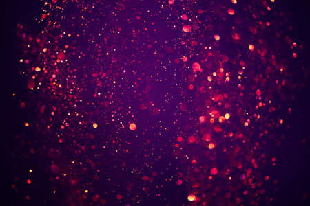 Abstract bokeh background of purple festive glitter lightsの写真素材