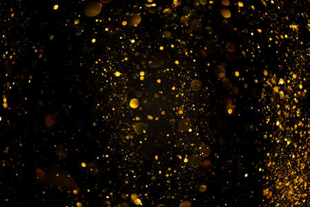 Gold glitter lights bokeh festive overlay abstract backgroundの写真素材