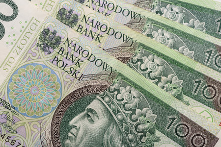 Polish paper currency, 100 zloty PLN bills closeup background top view