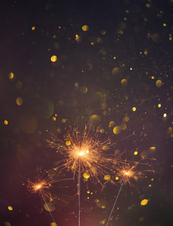 Happy New Year, Sparklers burning bright with shiny sparks and bokeh festive silvester party vertical backgroundの写真素材