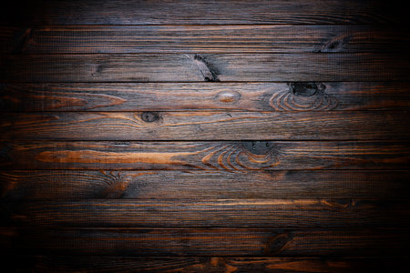 Dark stained wood texture, vignette wood backgroundの写真素材