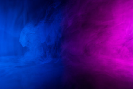 Abstract neon colored flowing smoke clouds backgroundの写真素材