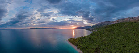 Panoramic colorful sunset on the coast in Croatia, split-Dalmatia regionの写真素材