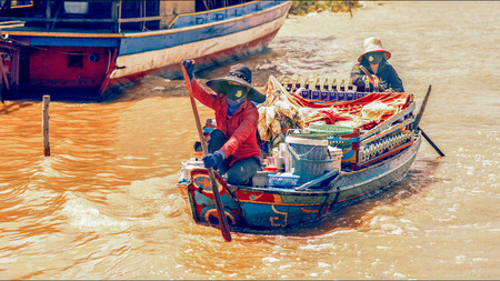 Tonle Sap Lake Siem Reap, Cambodia - July 13, 2013: Cambodian people live on Tonle Sap Lake in Siem Reap, Cambodia. Cambodian food vendor on the Tonle Sap lakeのeditorial素材