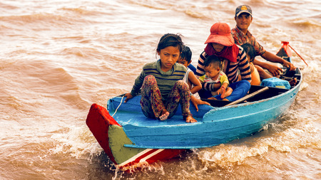 Tonle Sap Lake Siem Reap, Cambodia - July 13, 2013: Cambodian people live on Tonle Sap Lake in Siem Reap, Cambodia. Cambodian family on a boat near the fishing village of Tonle Sap Lake.のeditorial素材