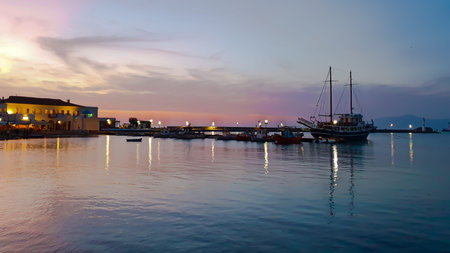 Mykonos, Greece, 08 November 2019: Colorful sunset view blue hour on the beach of Mykonos from the shoreのeditorial素材