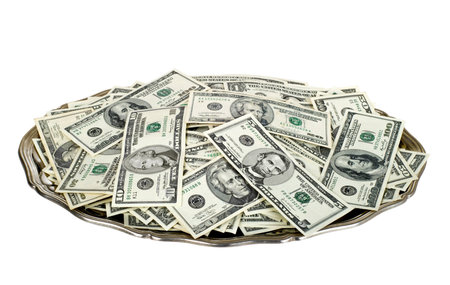 Hand money on silver platter. Dollar bills on tray isolated over white.