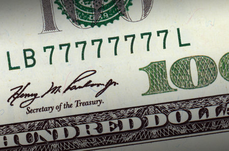 One hundred dollar bill with lucky number highlighted