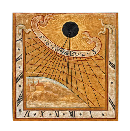 Medieval sun-dial painted on building wall in Krumlov, Czech Republic, isolated on white background 