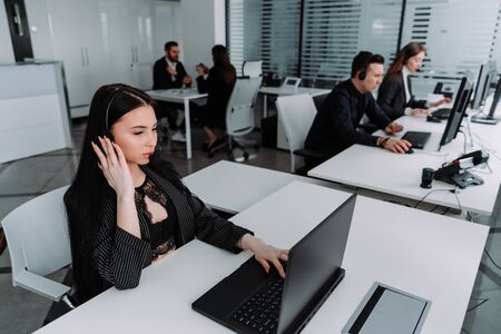 A team of business people working in a call center on the line.の写真素材