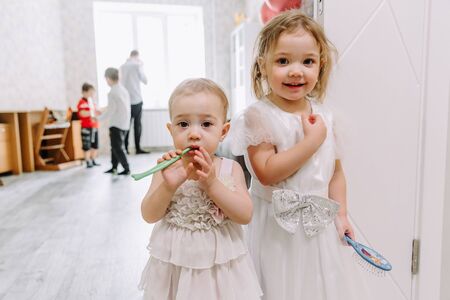 two little girls at a childrens birthday partyの写真素材