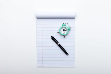Alarm clock, notes and pen