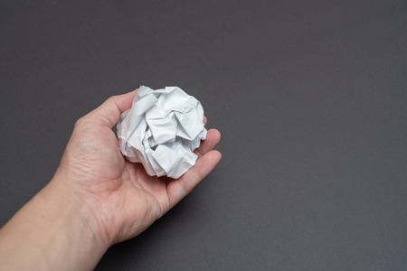 White paper over black backgroundの写真素材