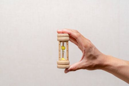 An hourglass in your handの写真素材