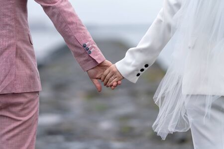 A loving couple holding handsの写真素材